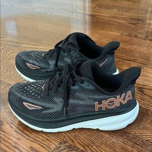 Hoka Black and Gold Clifton 9